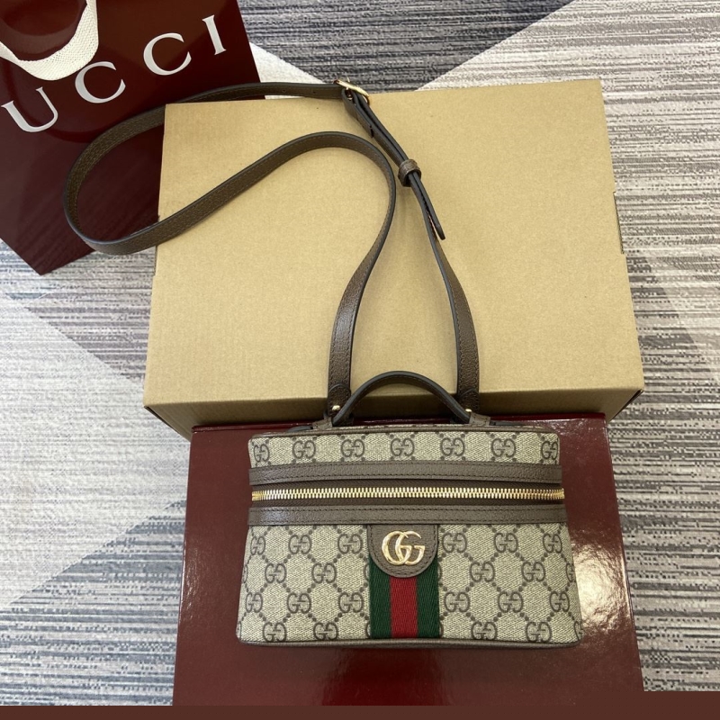 G*u*i cosmetic bags